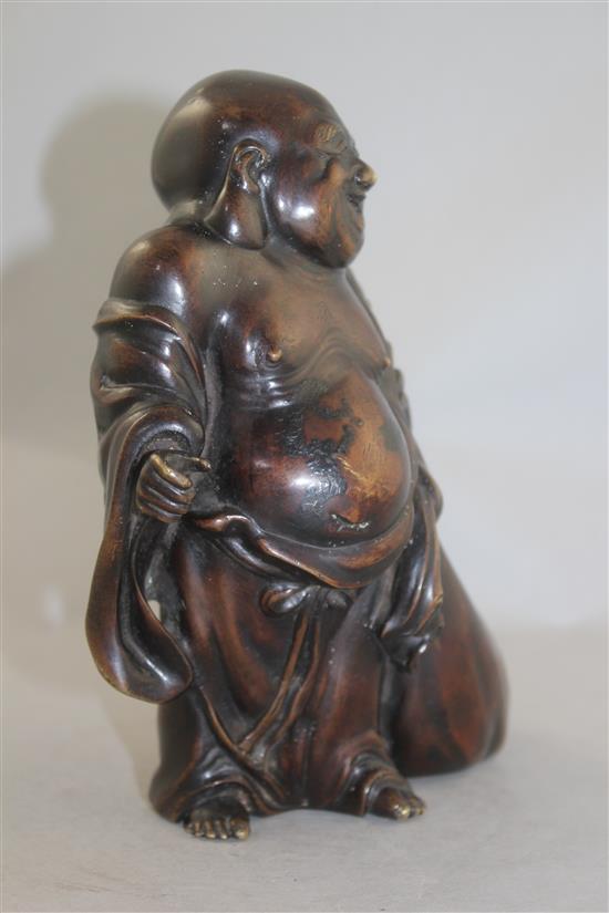 A Japanese bronze standing figure of Hotei, 19th century, 19cm